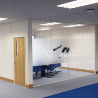 Glass meeting room partition installed in a commercial office