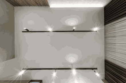 Contemporary suspended ceiling with integrated linear lighting