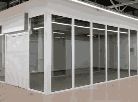 Commercial tiled floor surrounding a glazed retail unit
